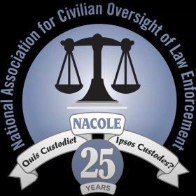 NACOLE Icon. Scales icon with a white ribbon at the bottom of it.