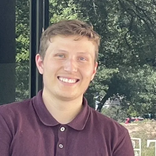 Photo of a white man smiling. 