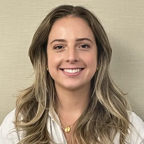 White woman smiling with brown hair