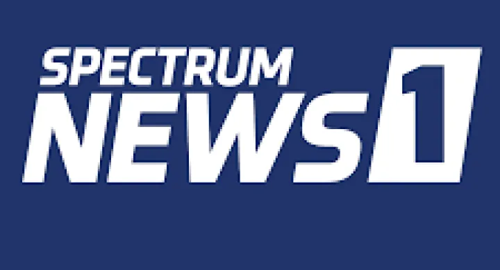 Image of Spectrum News 1 logo. White letters on navy blue background.